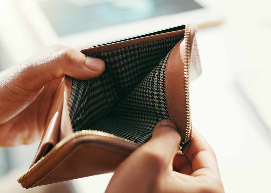 Hands, empty wallet and person with bankruptcy, financial crisis and economy collapse. Closeup, inf.