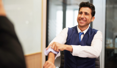 Diverse corporate team working together in modern meeting room office.
