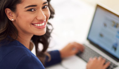 My business is on the up and up. Cropped portrait of a young businesswoman working on her laptop