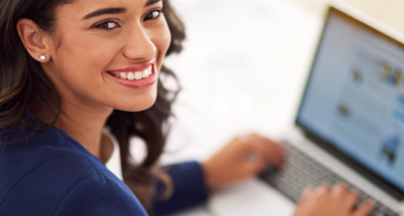My business is on the up and up. Cropped portrait of a young businesswoman working on her laptop