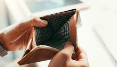 Hands, empty wallet and person with bankruptcy, financial crisis and economy collapse. Closeup, inf.