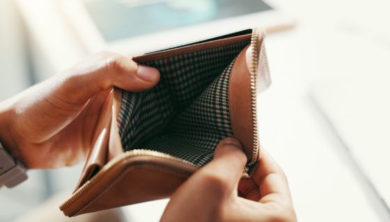 Hands, empty wallet and person with bankruptcy, financial crisis and economy collapse. Closeup, inf.